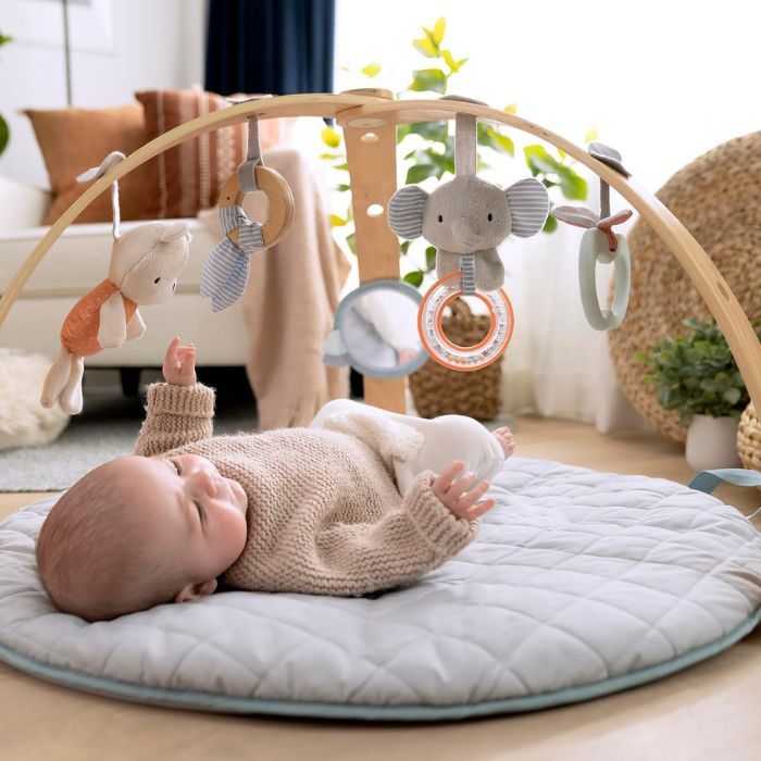 baby lying on compact play mat