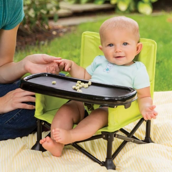 baby sitting in Summer Infant Pop 'N Sit Portable Booster Seat