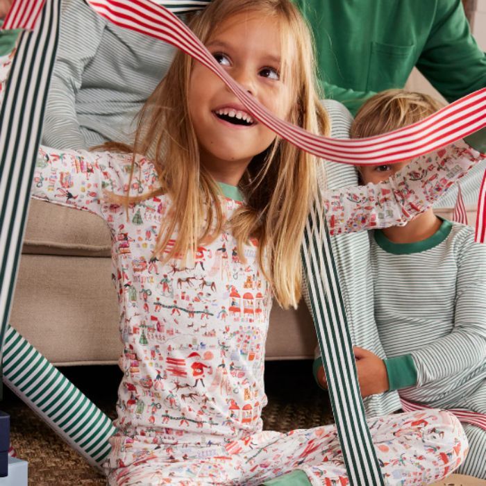 little girl wearing coordinating holiday pjs