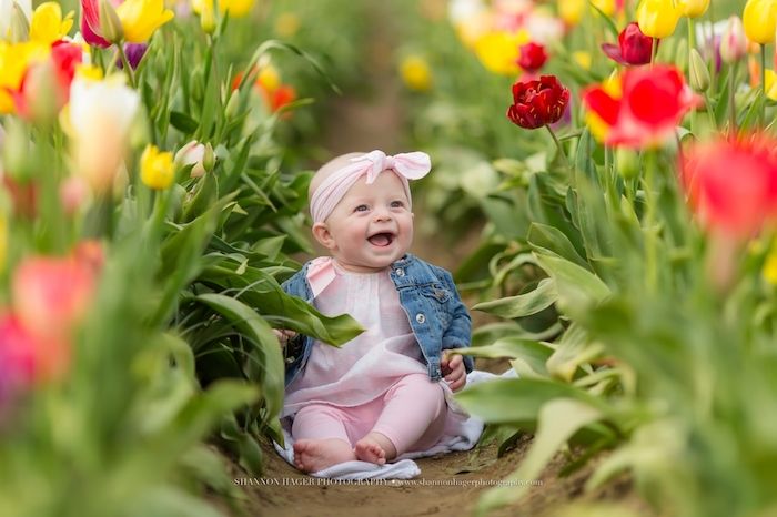 Baby's first Easter spring photo in tulip field