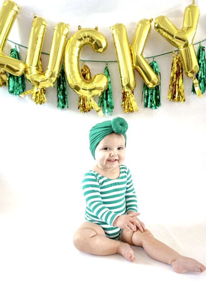 Lucky foil letter balloons green striped onesie St. Patrick's Day baby photo