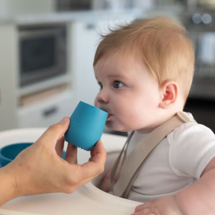 baby drinking out of an ezpz tiny cup