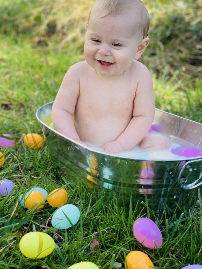 Baby's first Easter photo outdoor metal bucket milk bath with plastic eggs