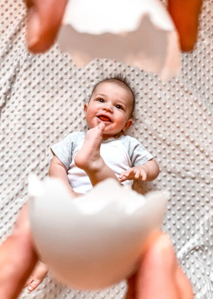 baby in photo of cracked egg