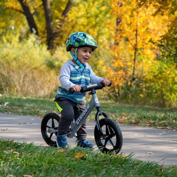 toddler riding a balance bike
