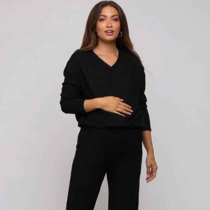 pregnant woman wearing black maternity pajamas
