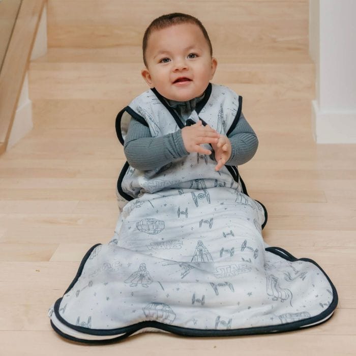 baby in a blue star wars sleep sack from copper pearl