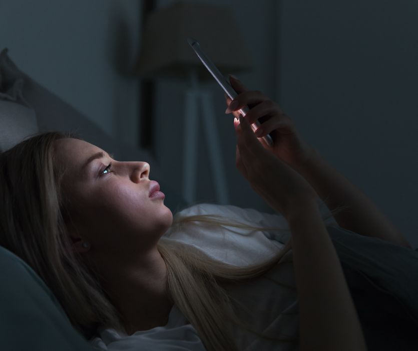 pregnant woman scrolling phone for answers