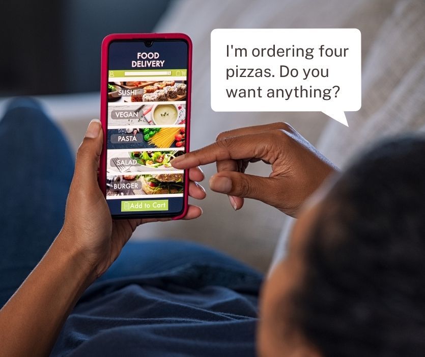 A person using a food delivery app on a smartphone with a text bubble saying, I'm ordering four pizzas.