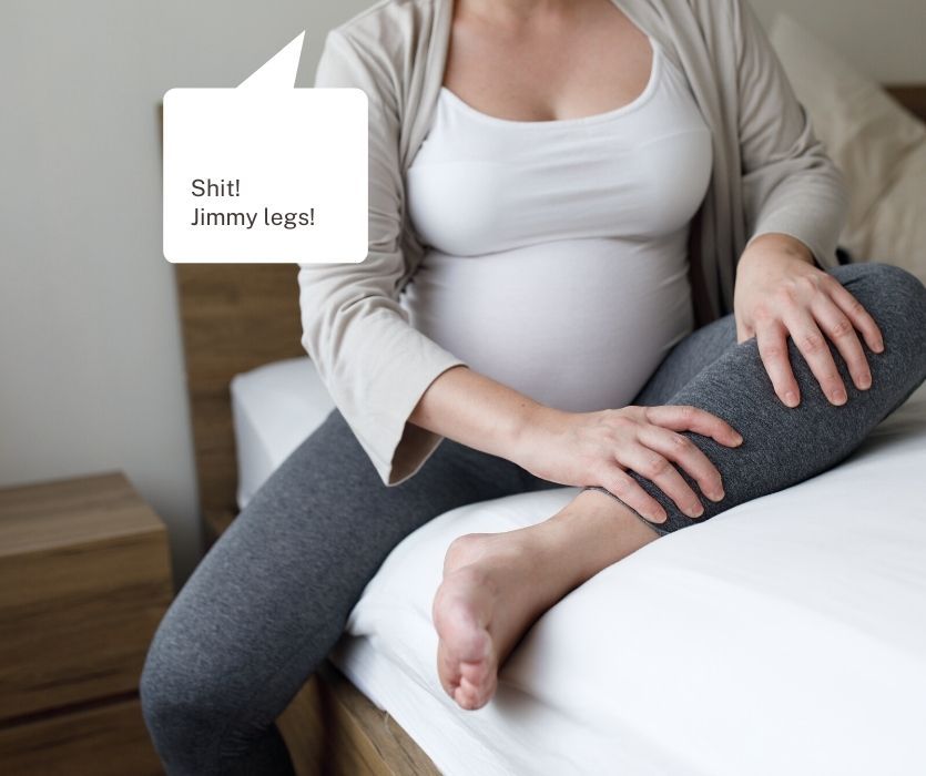 Pregnant person on a bed clutching their leg with a speech bubble saying Shit! Jimmy legs!
