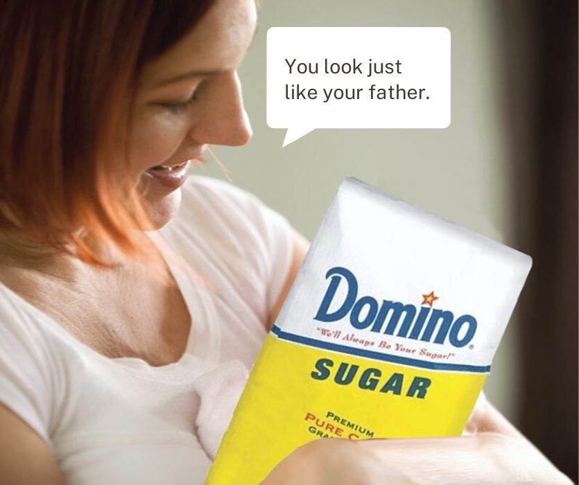 A woman cradles a bag of Domino Sugar like a baby with a speech bubble saying, You look just like your father.