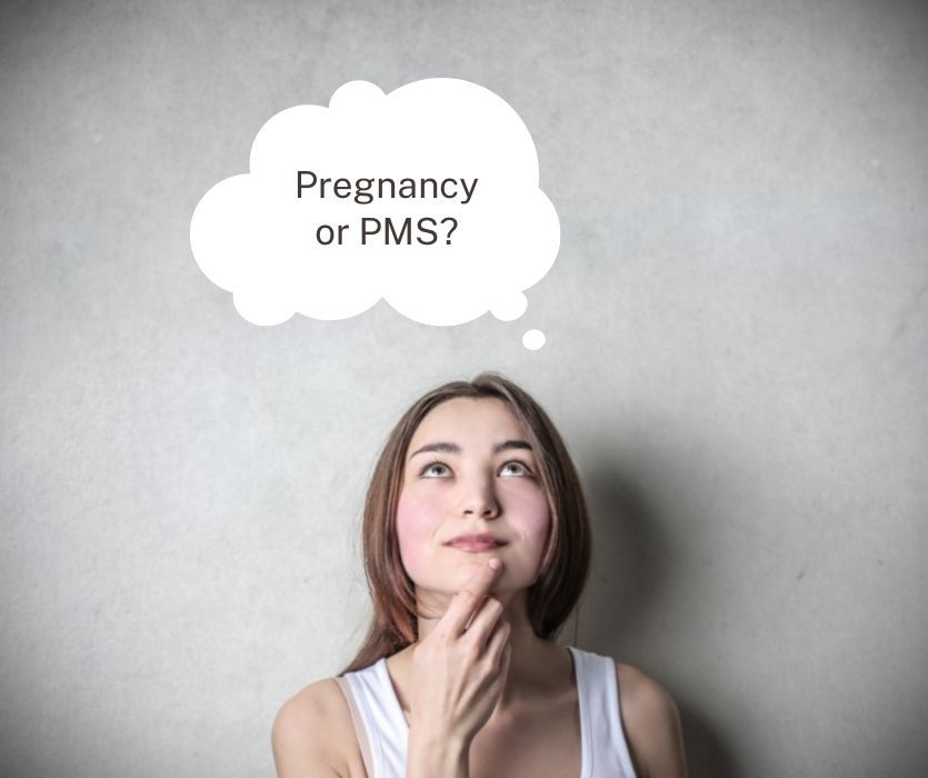 A person looking up at a thought bubble containing the text: Pregnancy or PMS?