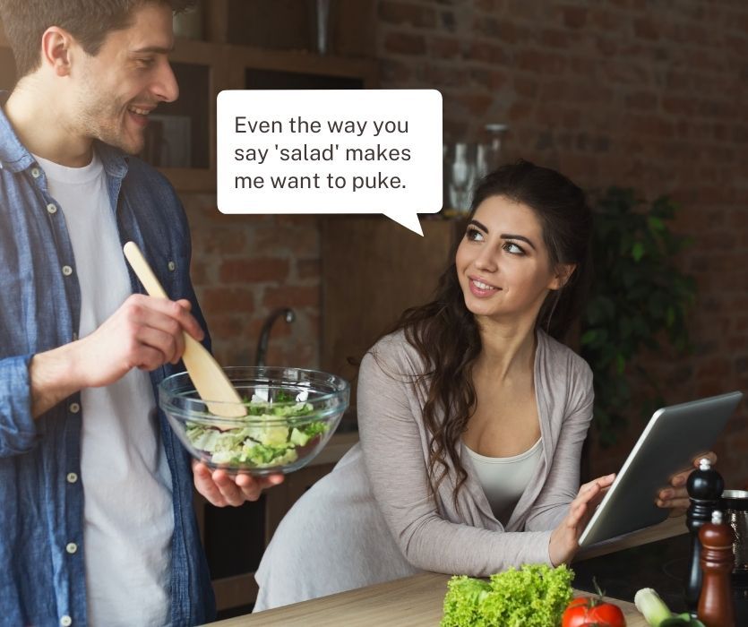 Man tosses salad while woman looks on. A speech bubble says even the way you say salad makes me want to puke.
