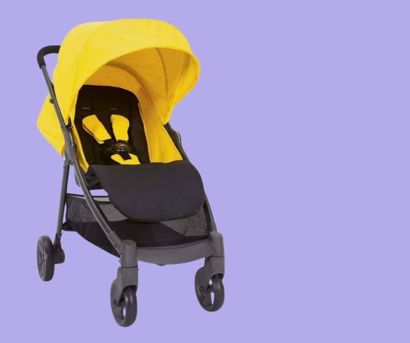 Yellow and black Armadillo stroller with an adjustable canopy and storage basket, set against a purple background.