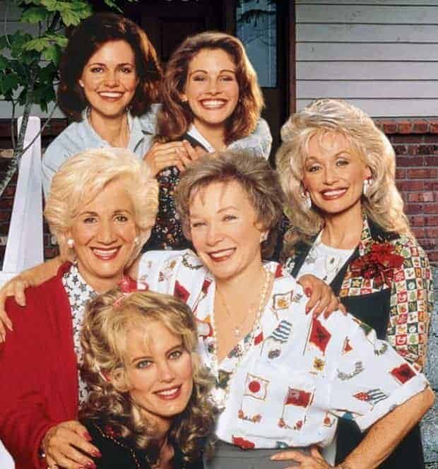 The ensemble cast of the movie Steel Magnolias smiling together in a group portrait.