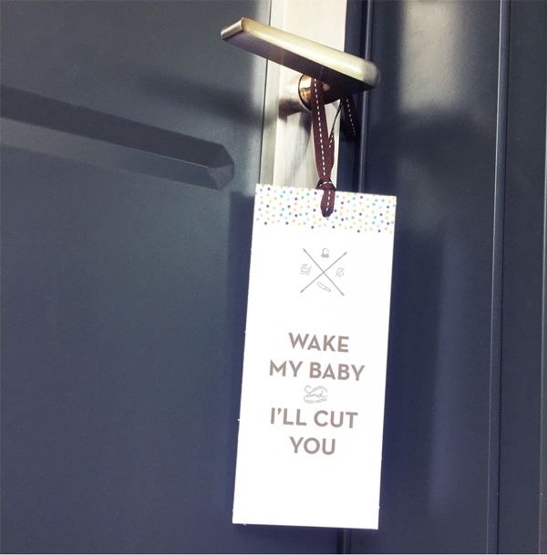 Door hanger on a handle reading: Wake my baby and I’ll cut you.