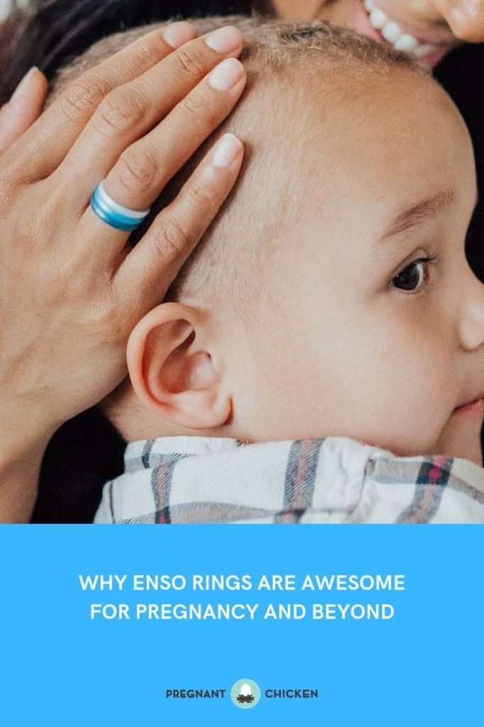 A mother's hand wearing three stacked Enso silicone rings rests on her young child's head.