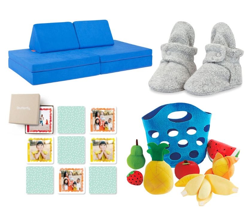Blue foam play couch, gray fleece booties, personalized photo memory cards, and plush toy fruit in a blue basket.