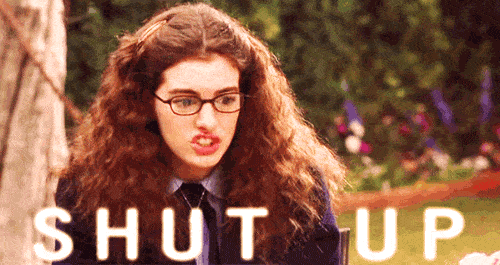 A woman with curly hair and glasses reacts angrily as the words SHUT UP appear across the bottom, matching the post about rude pregnancy remarks.