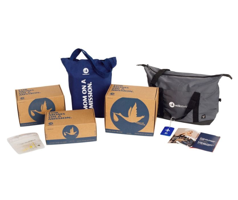 Milk Stork breast milk shipping boxes and cooler bags with a manual and storage bag on a white background.
