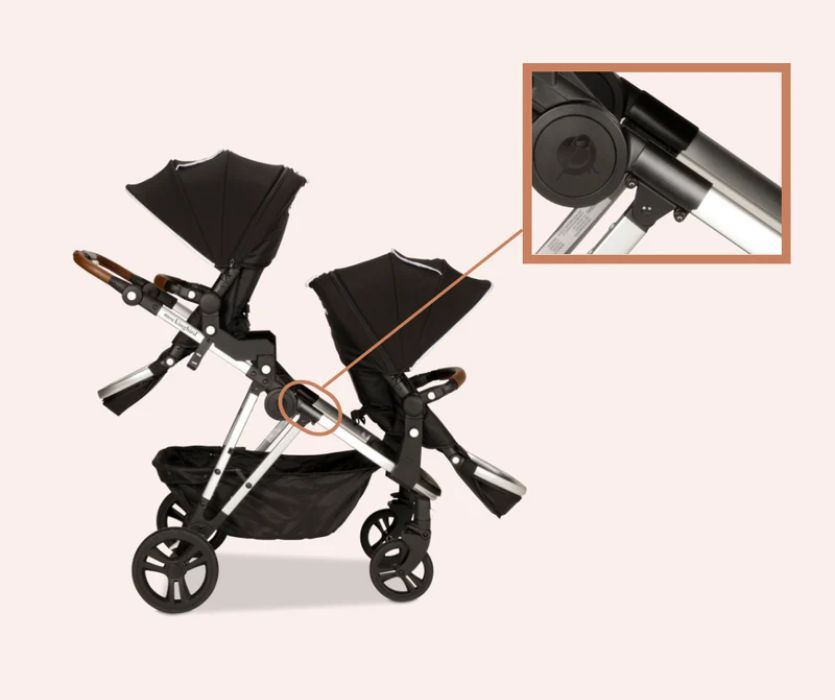 Double Mockingbird stroller with a circle and inset detail showing a support clamp on the side frame above the front wheel.