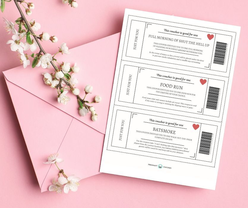 Printable vouchers for a new mom on a pink background next to an envelope and white blossoms.