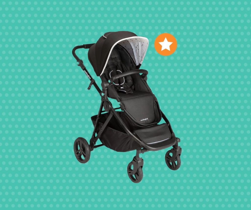 Black Mockingbird stroller with an open canopy on a teal polka dot background with a gold star icon.
