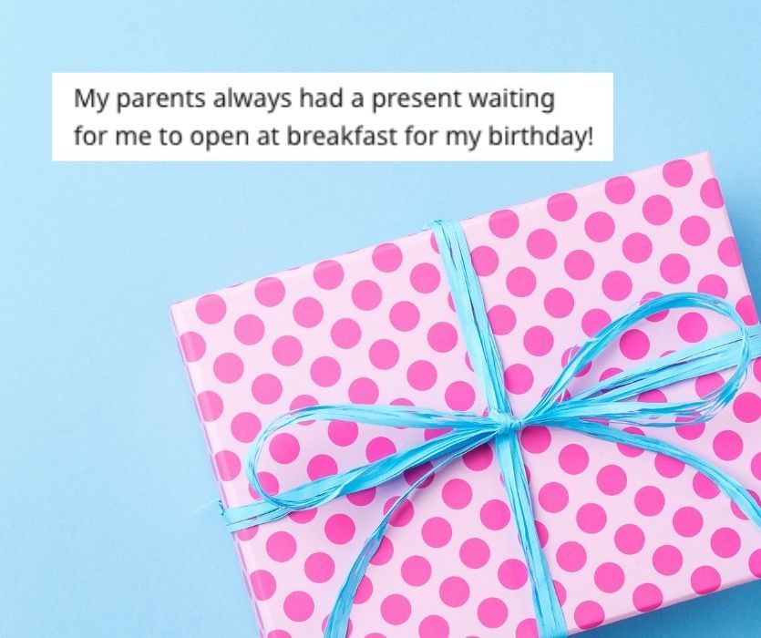 Pink and red polka dot gift box with a blue ribbon on a blue background. Text about a birthday morning tradition above.