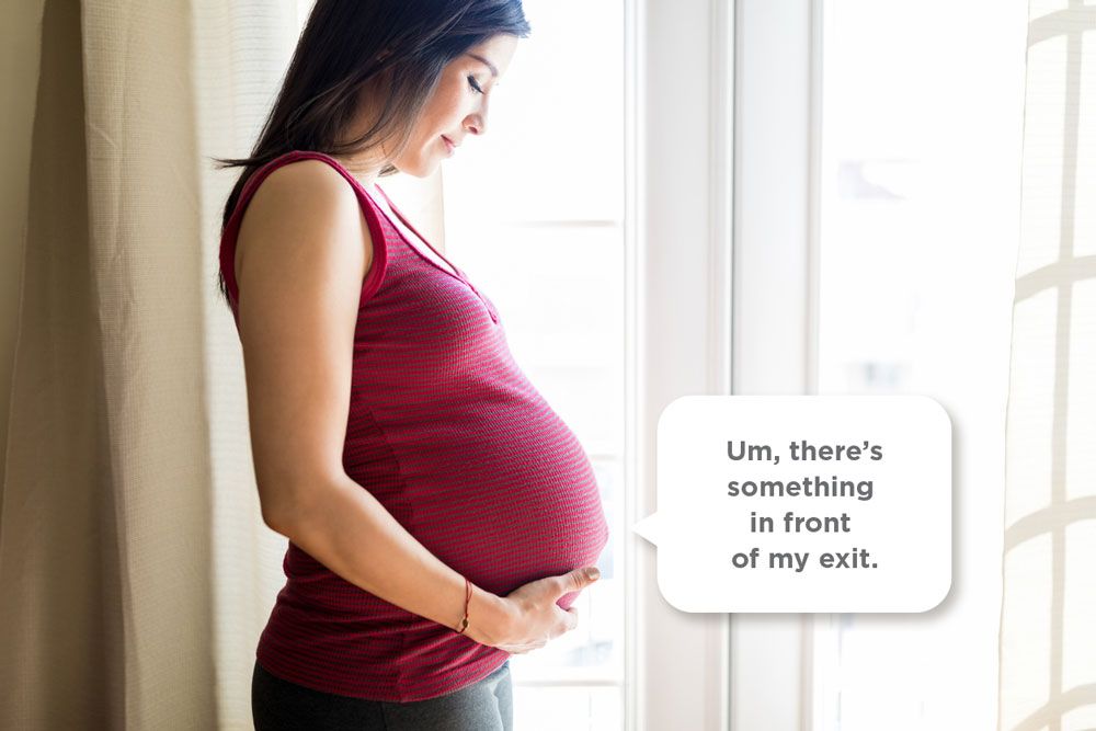Pregnant person looking down at their belly with a speech bubble: Um, there's something in front of my exit.