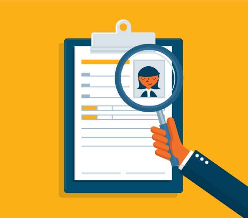 Illustration of a magnifying glass held over a profile of a woman on a clipboard.