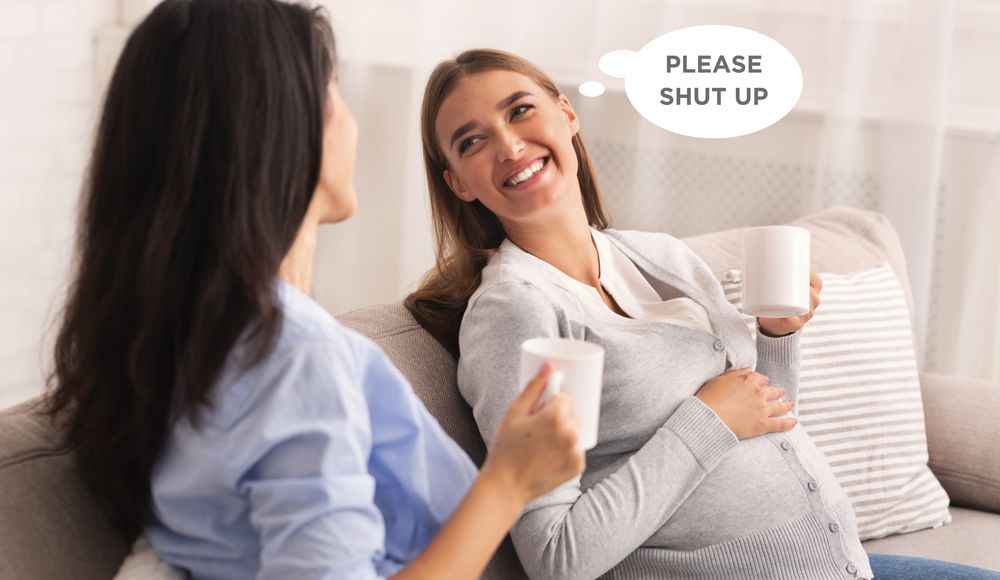 Two women talk over coffee; a thought bubble over the smiling pregnant woman reads, PLEASE SHUT UP.