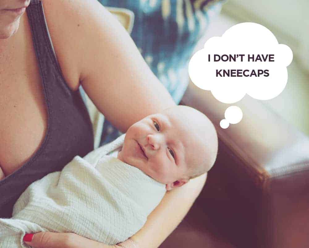 Swaddled baby held by an adult, with a thought bubble that reads: I don't have kneecaps.