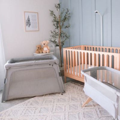 crib, playpen and bassinet in nursery